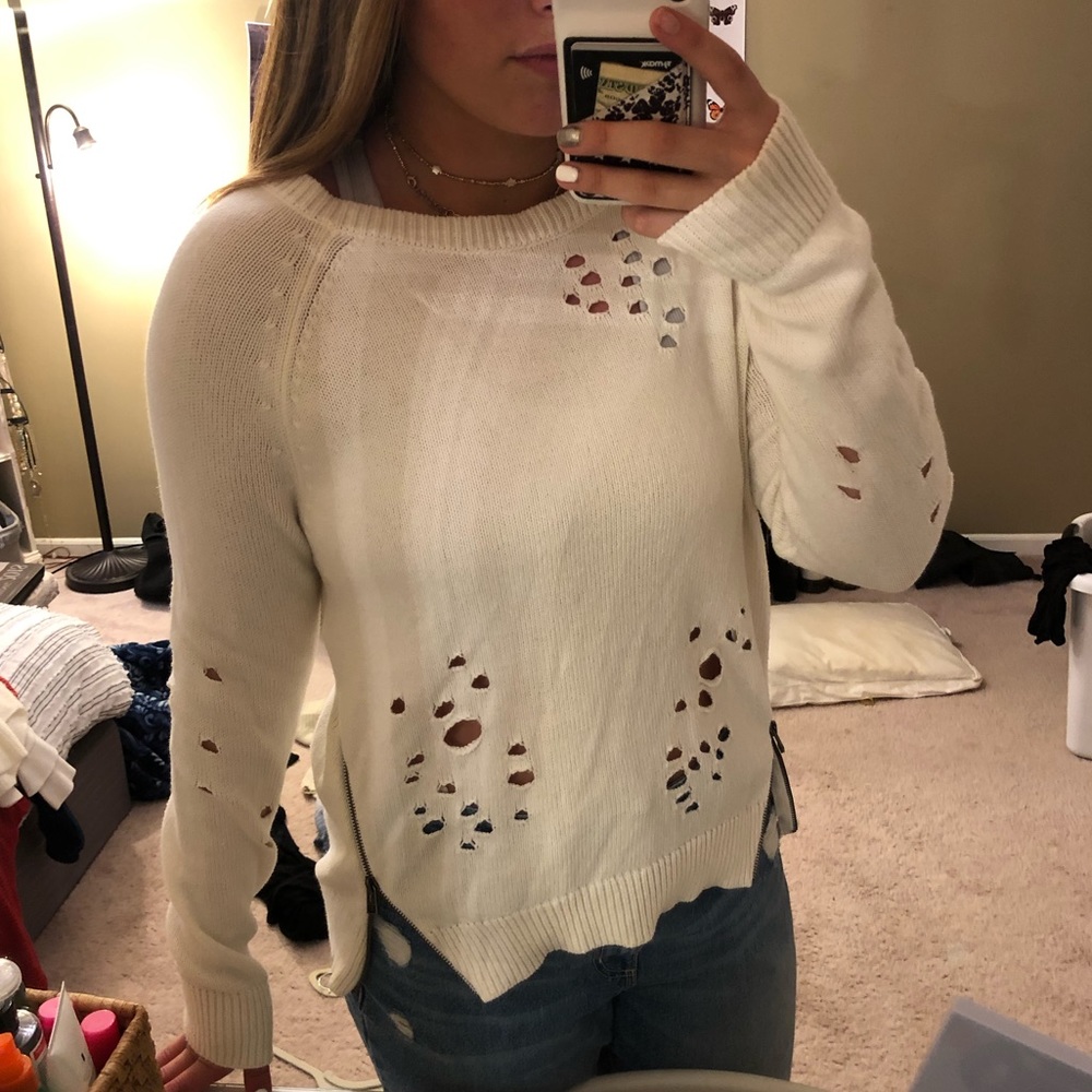 Distressed white sweater with zipper detail
